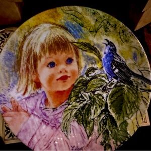 Decorative Plate with Child and Bird Design